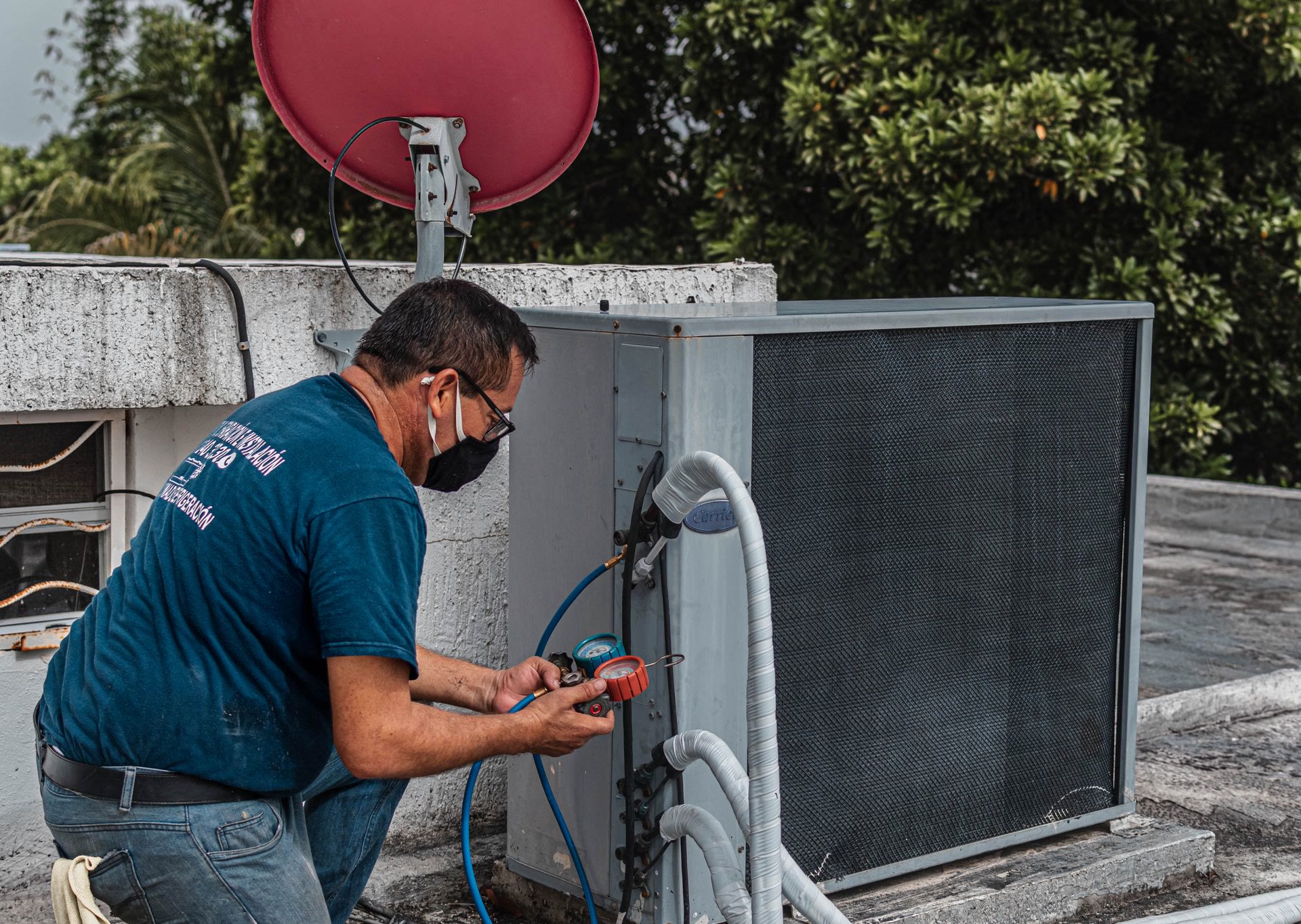 A Coastal Bend HVAC technician walking a homeowner through her AC repair